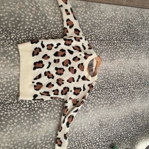 Vestique cow print sweater